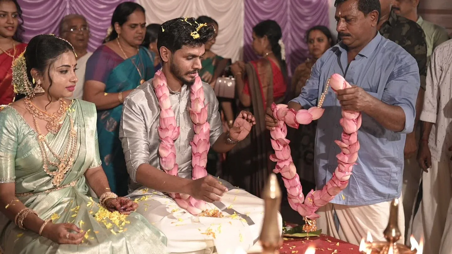 A South Indian couple with their family during a wedding ceremony